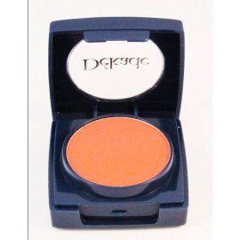 Un recipiente con sombra de ojos naranja en un estuche azul.