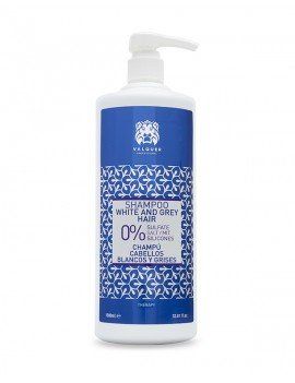 Una botella de champú para cabello blanco y gris con bomba.
