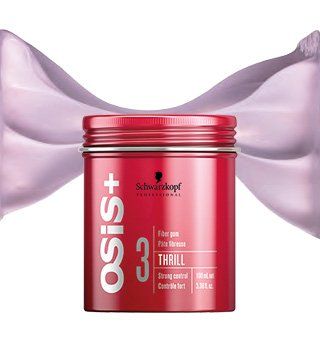 Una botella roja de Schwarzkopf Osis 3 Thrill