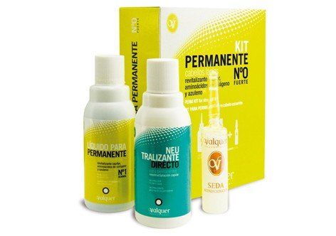 Hay dos botellas de tinte permanente para el cabello junto a una caja.
