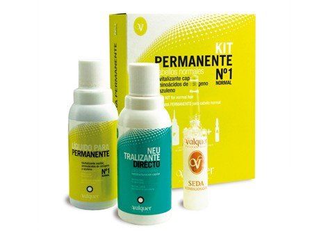 Una caja con tres botellas de tinte para el cabello dentro.