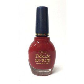Una botella de esmalte de uñas Dekade de color rojo.