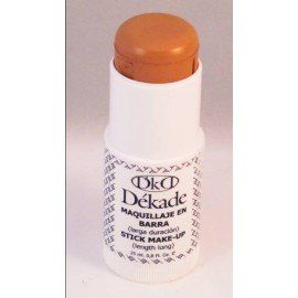 Una botella de maquillaje en barra Dekade se encuentra sobre una superficie blanca.