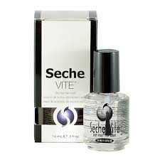 Una botella de esmalte de uñas Seche Vite junto a una caja.