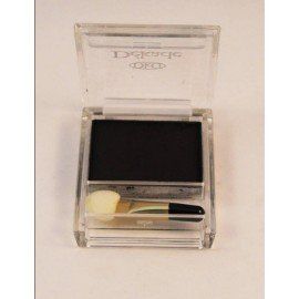 Una sombra de ojos negra en un recipiente transparente con un pincel.