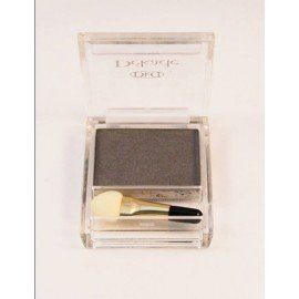 Una caja de sombras de ojos con un pincel dentro.