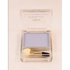 Una sombra de ojos azul en una caja transparente con un pincel.