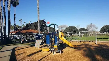 HWH San Diego Hard Money Lender - Real Estate showcases the coastal lifestyle and property appeal near Buccaneer Park in Oceanside. The image highlights sandy beaches, a small lagoon, and recreational areas that reflect the charm of Southern California living.