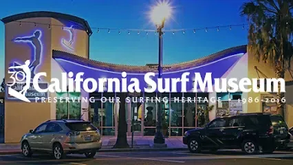 HWH San Diego Hard Money Lender - Real Estate emphasizes cultural charm and investment appeal near the California Surf Museum in Oceanside. The image highlights exhibits celebrating surf history, coastal lifestyle, and Southern California’s beach culture.