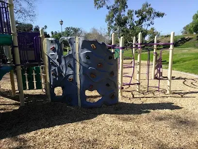 HWH San Diego Hard Money Lender - Real Estate highlights the family-friendly charm and investment appeal of Hilltop Park in Chula Vista. The image shows open play areas, scenic walking paths, and panoramic views that capture the lifestyle benefits of the community.