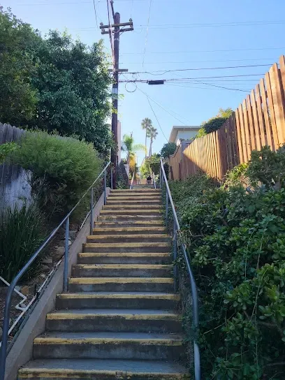 HWH San Diego Hard Money Lender - Real Estate highlights unique outdoor living and investment potential near the La Mesa Secret Stairs. The image showcases scenic staircases winding through lush neighborhoods, offering exercise paths and picturesque views of the community