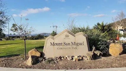 HWH San Diego Hard Money Lender - Real Estate emphasizes community living and investment opportunities near Mount San Miguel Park. The image showcases wide open fields, playgrounds, and scenic mountain views that reflect the area’s family-friendly lifestyle.