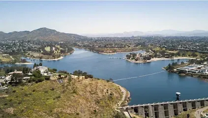 HWH San Diego Hard Money Lender - Real Estate highlights scenic recreation and investment appeal near Lake Murray in La Mesa. The image showcases calm waters, walking trails, and lush surrounding greenery that reflect the area’s outdoor lifestyle and community charm.
