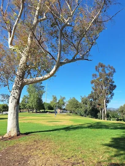 HWH San Diego Hard Money Lender - Real Estate highlights neighborhood charm and investment potential near Rod McLeod Park in Escondido. The image features open play areas, shaded picnic spots, and mountain views that reflect the city’s welcoming, family-friendly atmosphere.
