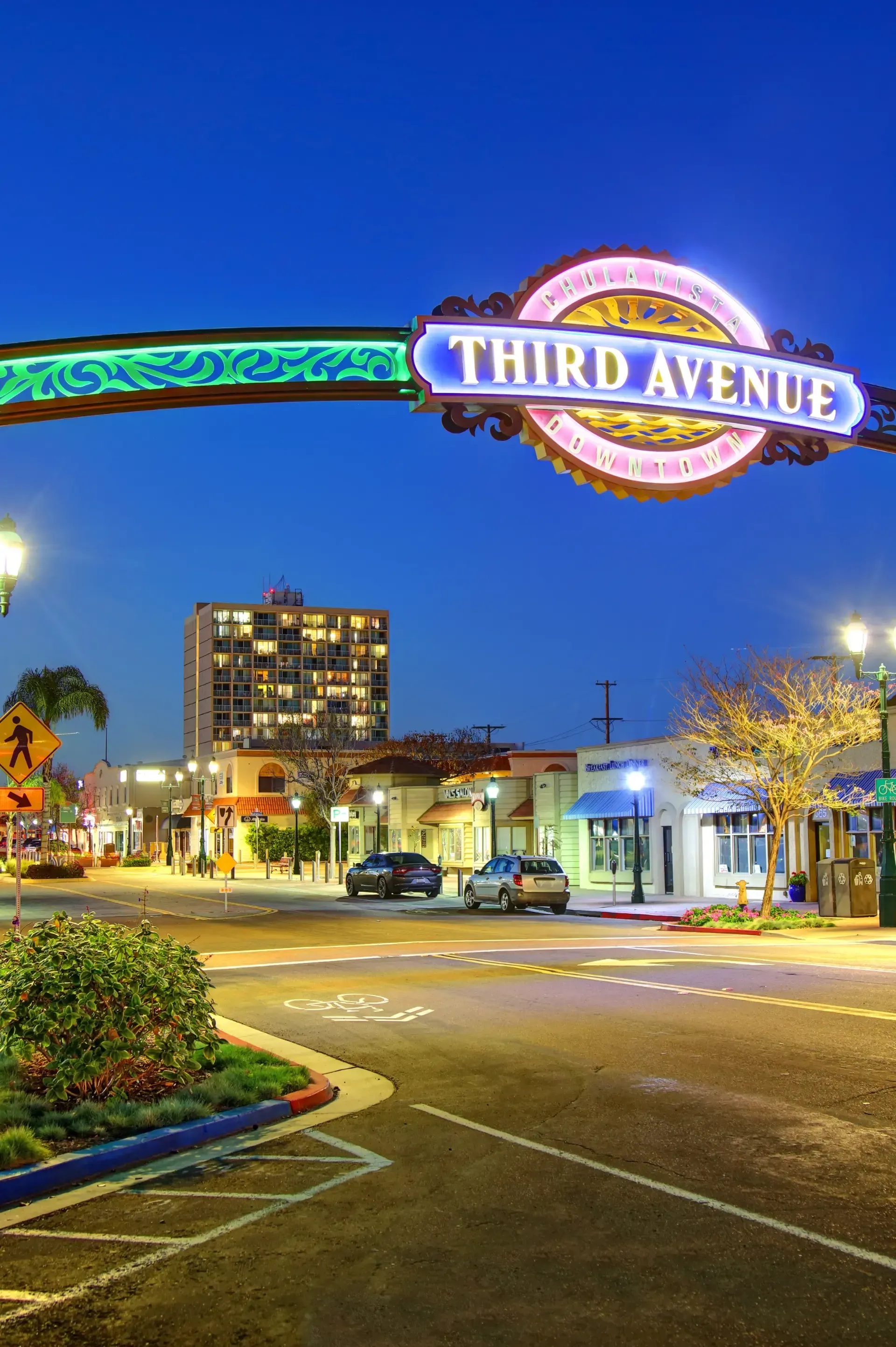 HWH San Diego Hard Money Lender - Real Estate highlights a signage anchor that proudly says “Chula Vista” at night, surrounded by a glowing city full of lights.