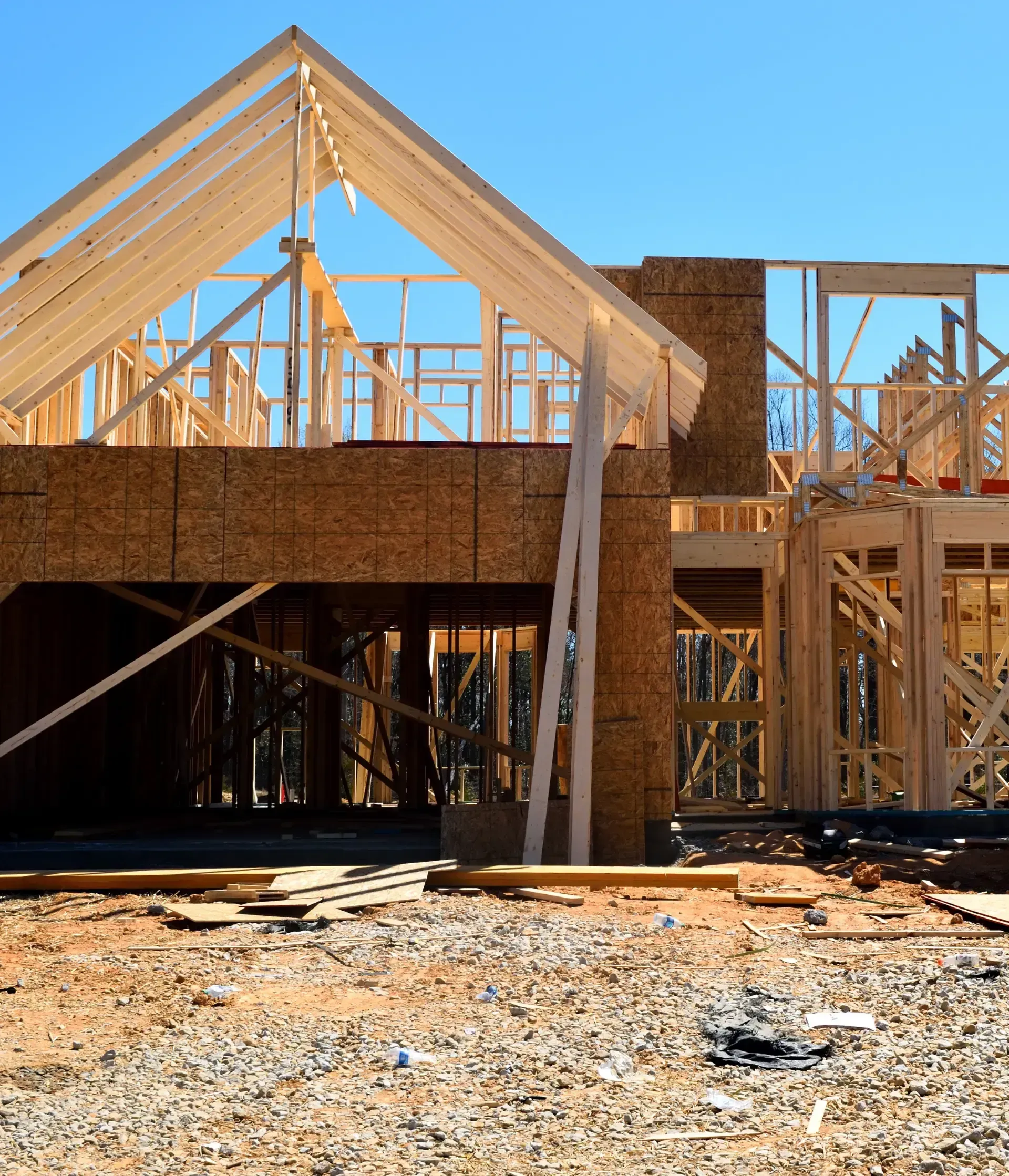 San Diego Hard Money Lender - The image shows a wooden house frame under construction, highlighting financing options for builders and investors.