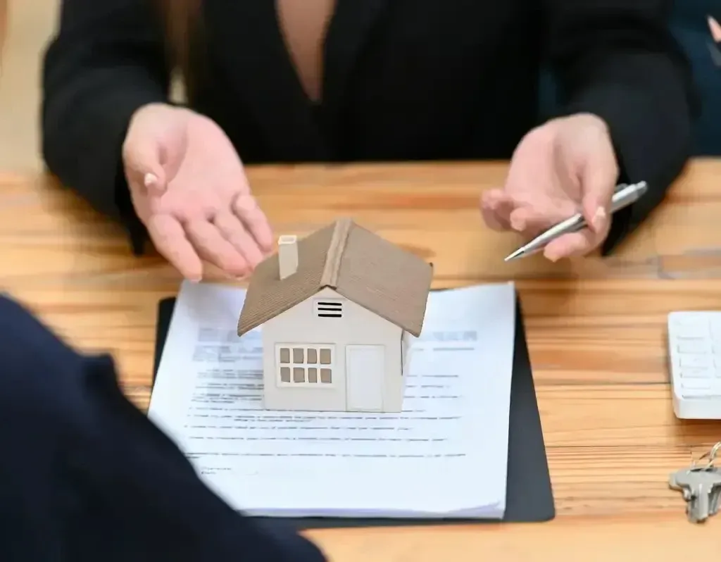 San Diego Hard Money Lender - The image shows a real estate professional discussing loan terms with a client, symbolizing smooth and efficient funding solutions.