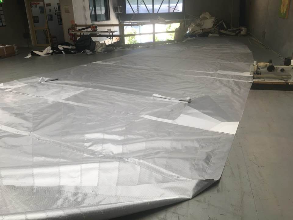 A Large Piece of Plastic is Laying on the Floor in a Room — Off Shore Sails & Rigging In North Boambee Valley, NSW