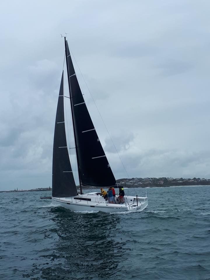 A Sailboat is Floating on Top of a Body of Water — Off Shore Sails & Rigging In North Boambee Valley, NSW