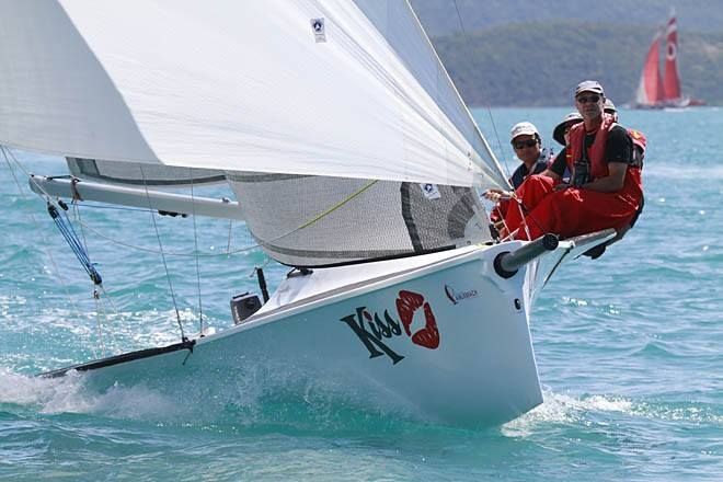 A Group of People Are Riding on the Back of a Sailboat in the Water — Off Shore Sails & Rigging In North Boambee Valley, NSW
