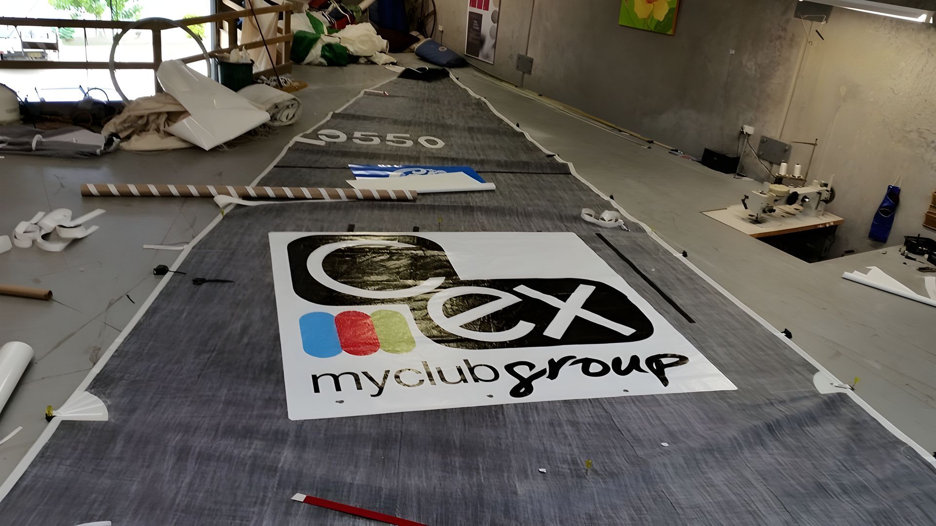A Sailboat is Docked at a Dock in the Water — Off Shore Sails & Rigging In North Boambee Valley, NSW
