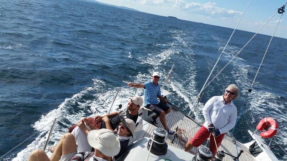 A Group of People Are on a Sailboat in the Ocean — Off Shore Sails & Rigging In North Boambee Valley, NSW