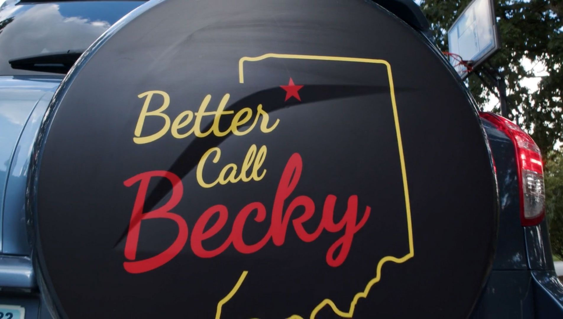 A car with a tire cover that says better call becky