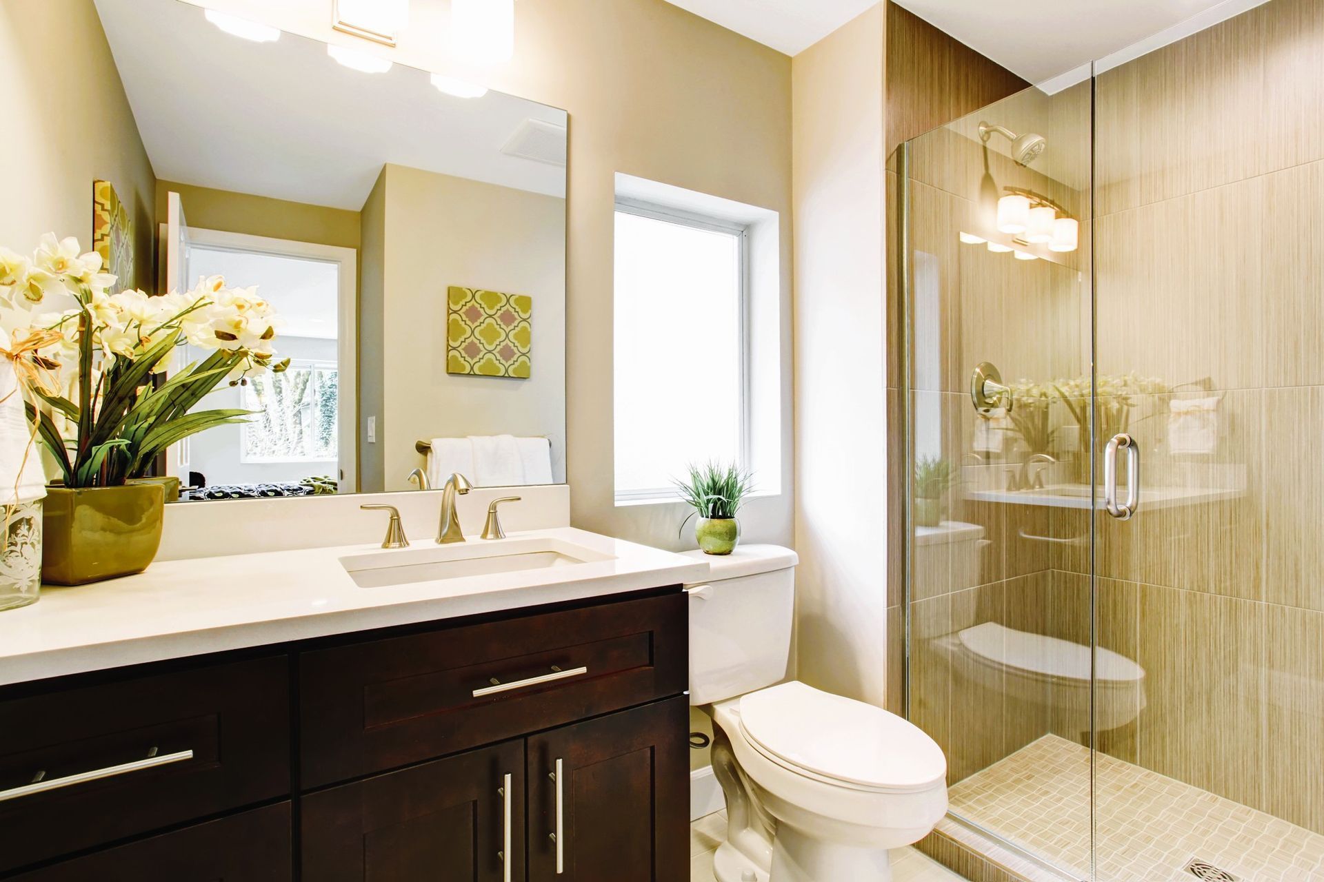 Modern small bathroom with glass shower, large mirror, and vanity design