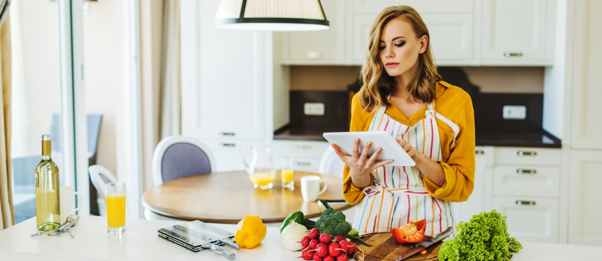 woman looking at recipe on her ipad