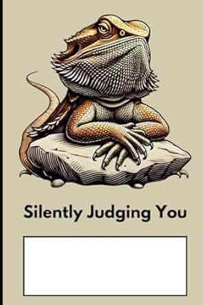 A bearded dragon is sitting on a rock with its arms crossed.