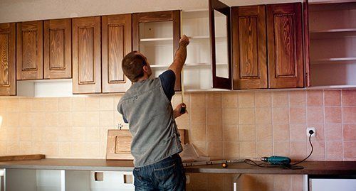 Kitchen cabinet being installed by expert