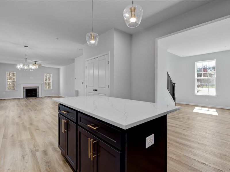 A kitchen with a large island in the middle of the room.