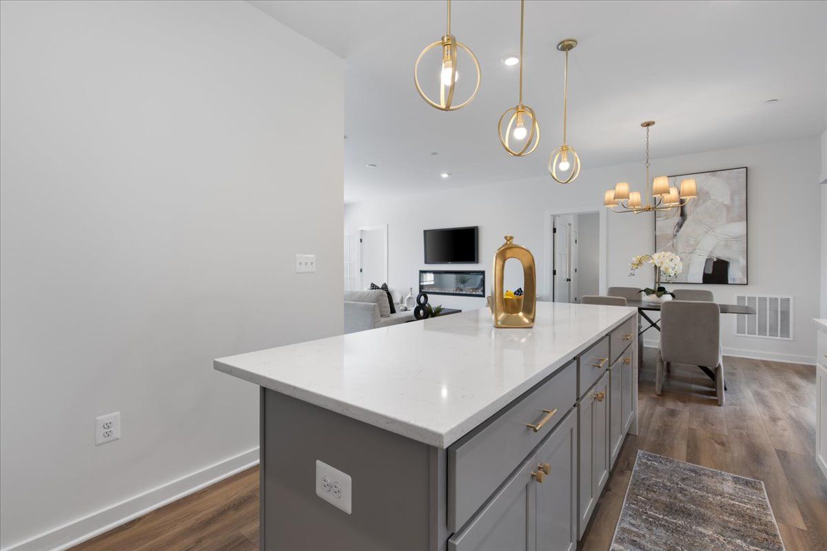 There is a large island in the middle of the kitchen.