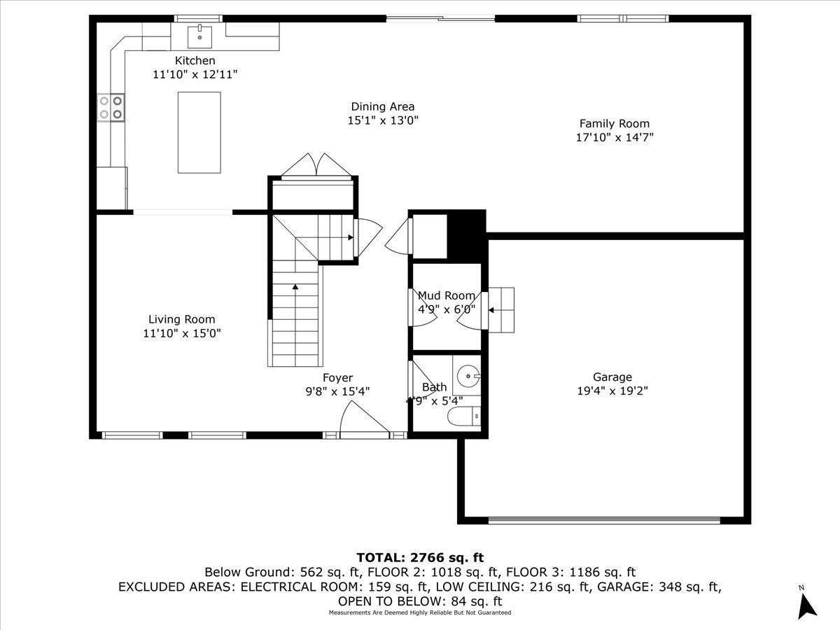 A black and white floor plan of a house with a staircase.