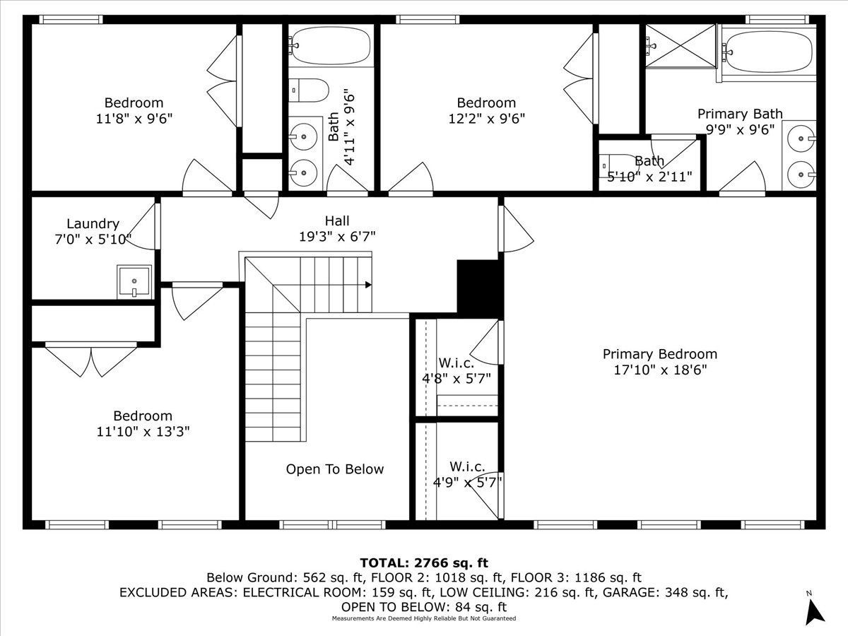 A black and white floor plan of a house with a staircase.