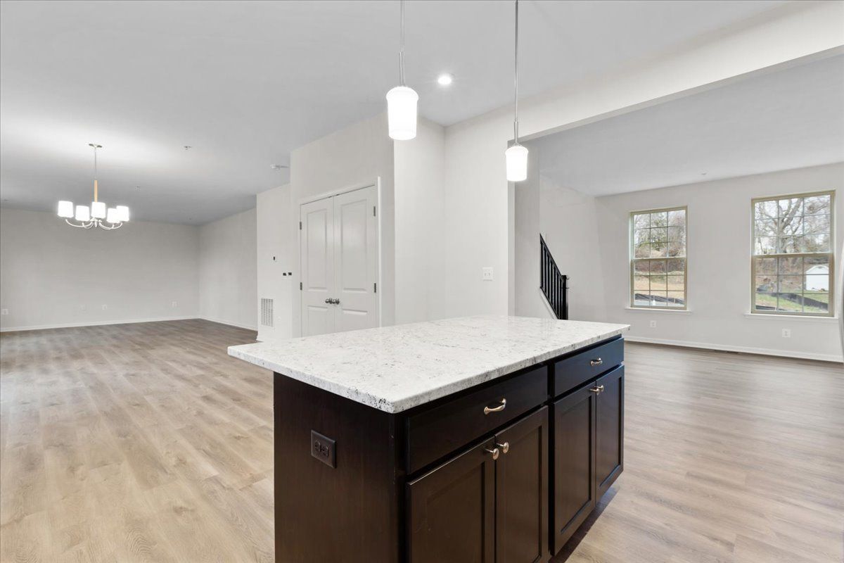 A kitchen with a large island in the middle of the room.
