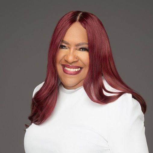 Dr. Sanja Rickette Stinson at the FaithInspiration Network conference, sharing insights on faith