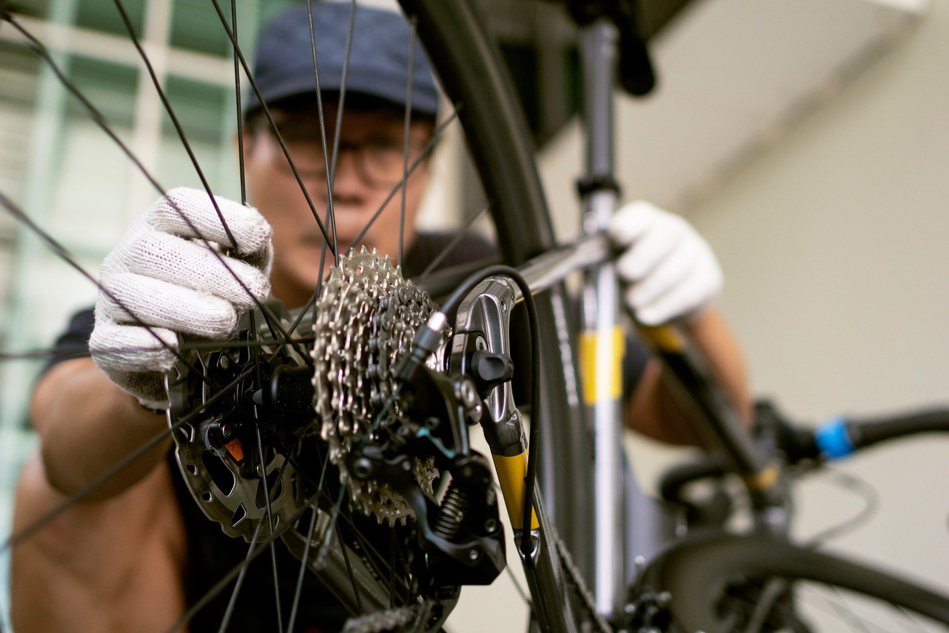 Mechanic Repairing Bicycle Break — Columbia, MO — Jim's Bike & Key Shop