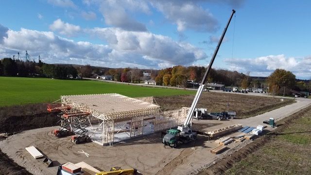 An aerial view of a construction site with a large crane.