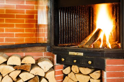 Wood Stove — Wood Fire Burning in a Chimney Insert in Madison, Wisconsin