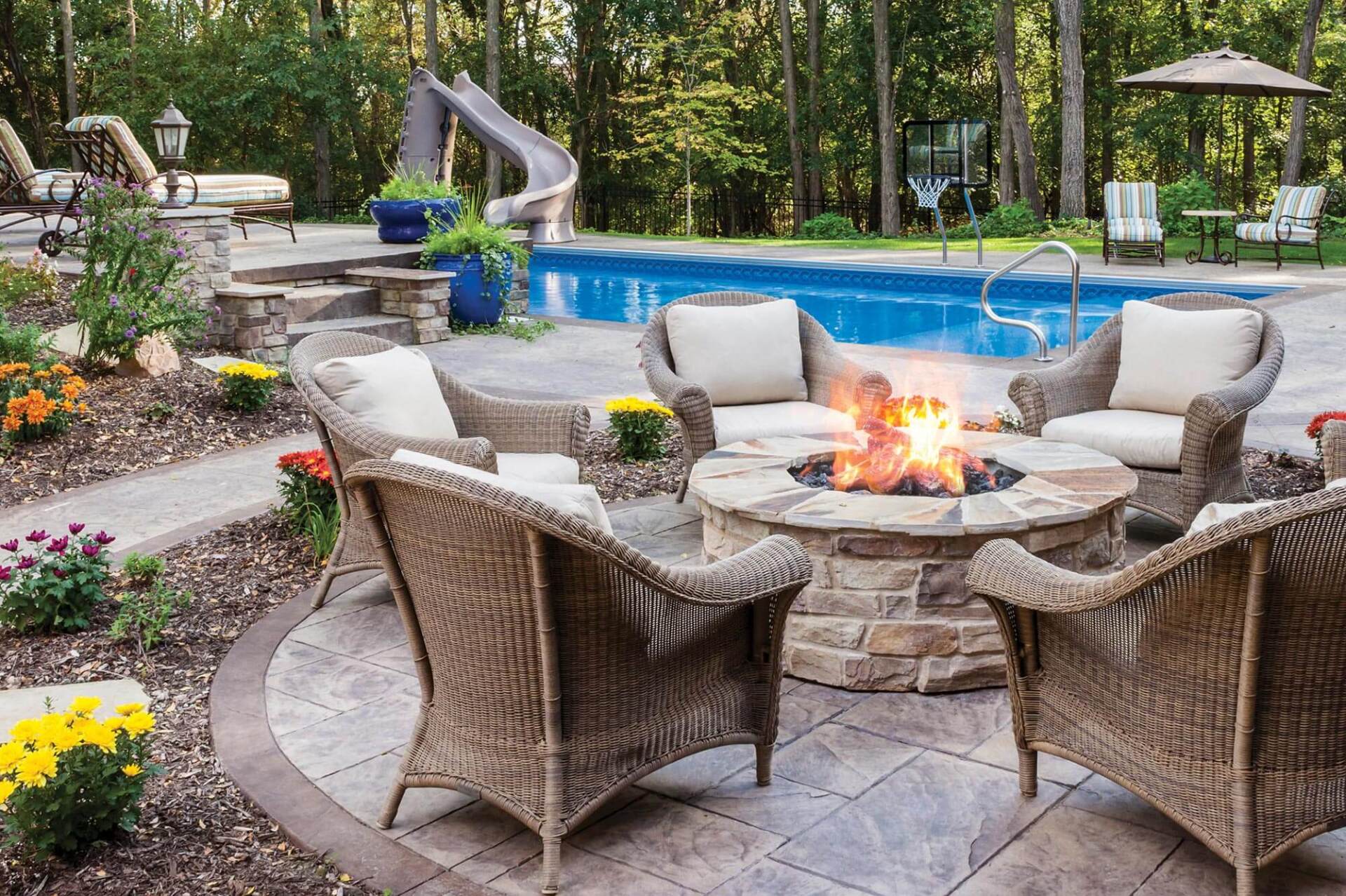 patio furniture in front of a pool