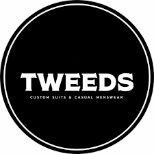 A black and white logo for tweeds custom suits and casual menswear.