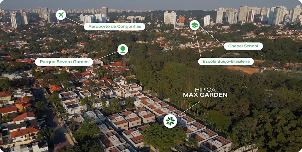 Uma vista aérea de uma área residencial com uma cidade ao fundo.