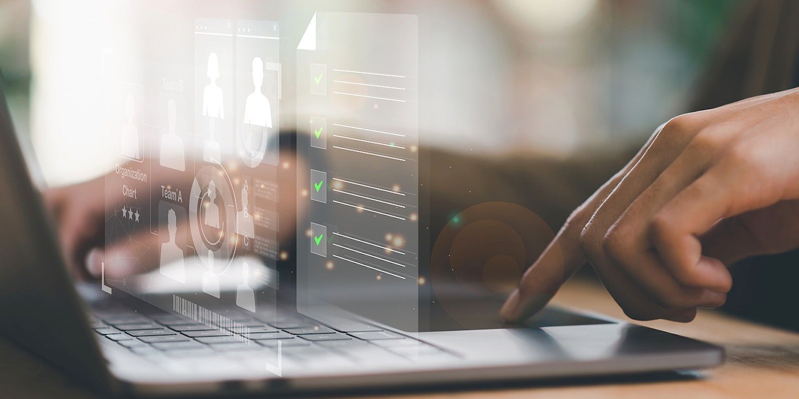 Person using a laptop with transparent UI elements overlaid on the screen.