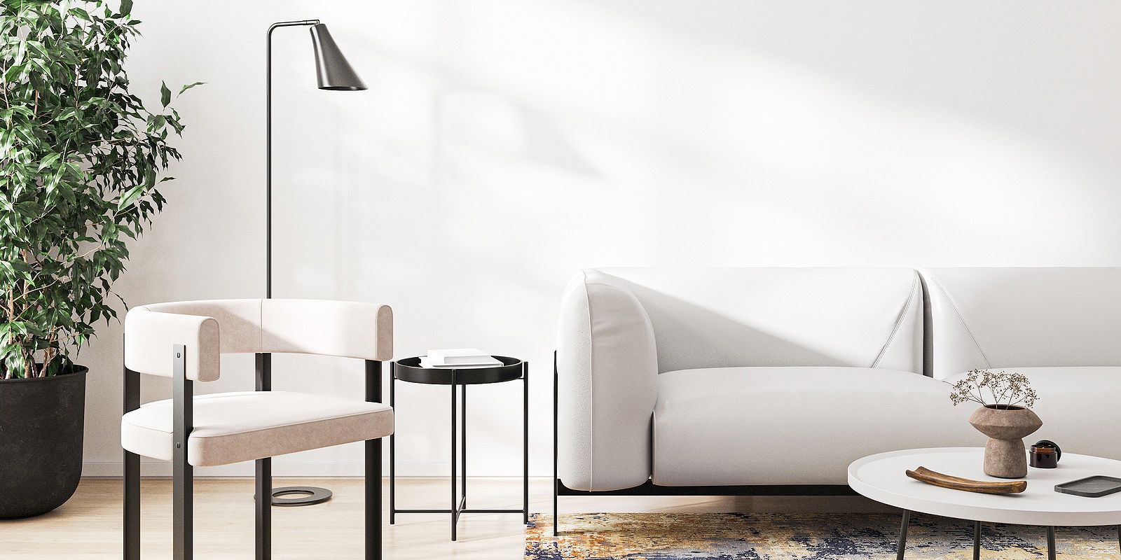 Modern living room with a white sofa, chair, and floor lamp against a white wall.