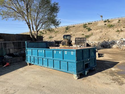 Waste Company — Debris Container Filled With Concrete Rubble in Northridge, CA