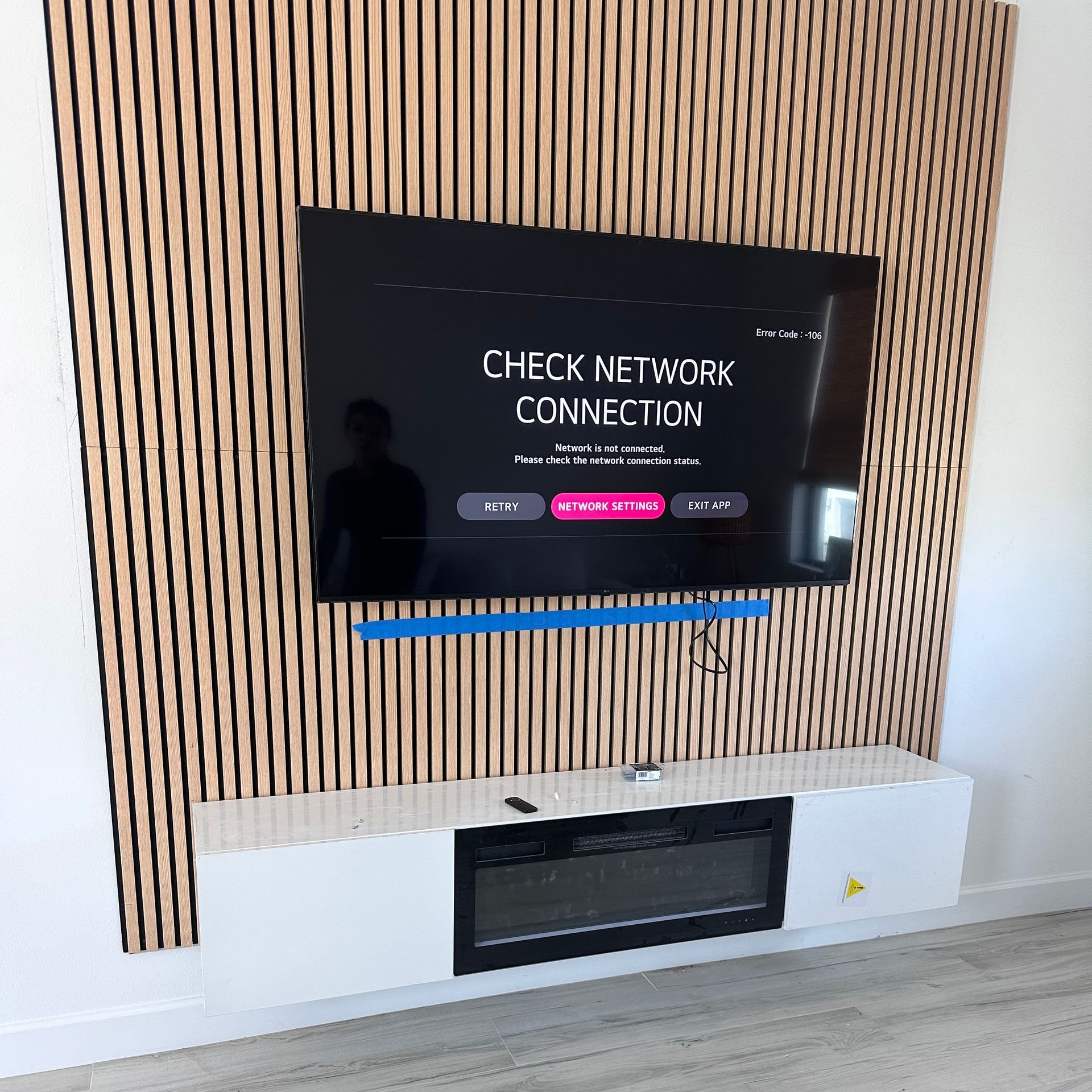 A mounted TV displays a