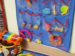 Children's toys in blue wall organizer - Child Care Center in Renton, WA