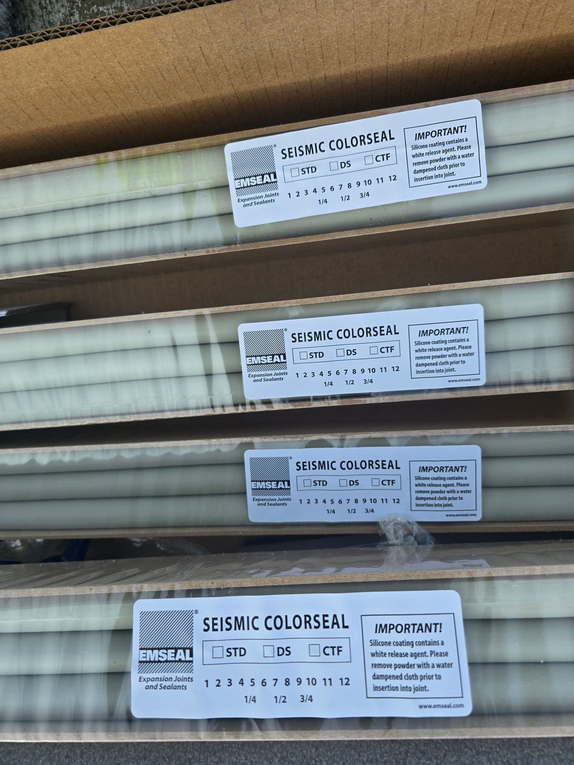 Boxes of cylindrical tubes labeled