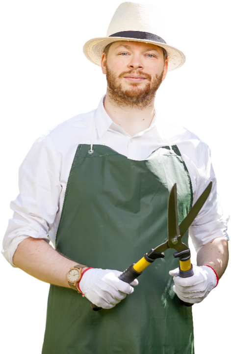 a man in a hat and apron is holding a pair of scissors